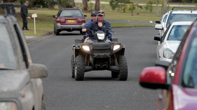 Police on the street in the early days of the search for missing William Tyrrell.