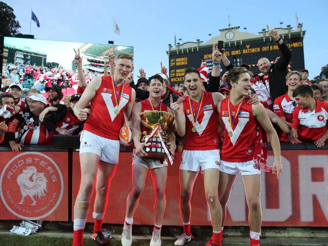 SANFL GRAND FINAL - Norwood versus North Adelaide. North Adelaide players celebrate. Samuel McInerney with cup and team mates. 23 September 2018. (AAP Image/Dean Martin)