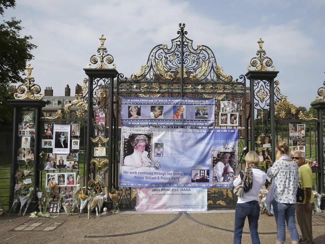 Photographs of Diana, Princess of Wales, and floral tributes left outside Kensington Palace in Central London ahead of the 20th anniversary of her death. Picture: AFP