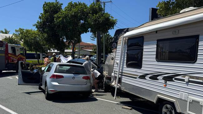 A ute towing a caravan was travelling north on Brisbane Road at Mooloolaba when it veered into oncoming traffic and struck five vehicles, including a parked car, which was pushed into a gardener who died.