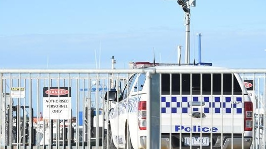 Police on scene at the Portarlington Pier. Picture: David Smith