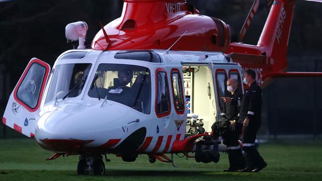 The Air Ambulance lands on the oval at Jan Juc to assist a boy injured in a bike accident. Picture: Alison Wynd