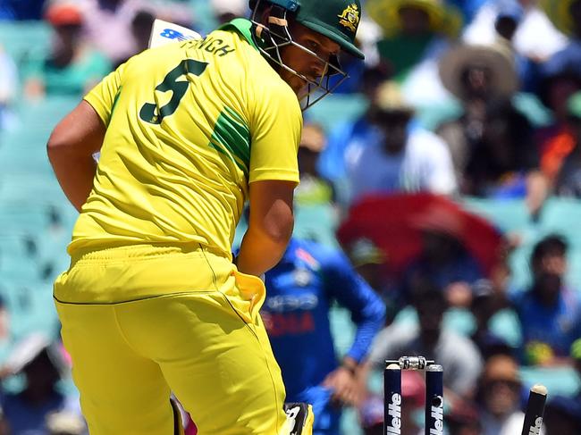 Aaron Finch is bowled by India's Bhuvneshwar Kumar in the first one-dayer at the SCG. Picture: AFP 