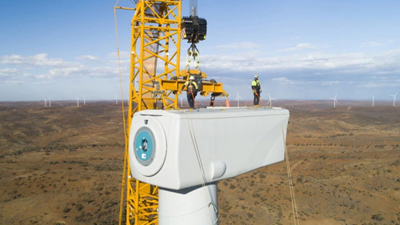 Coopers Gap workers atop one of the turbines.