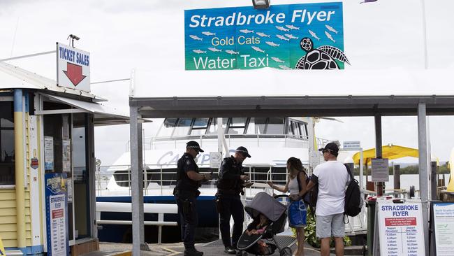 Police checking passengers for a Stradbroke Island ferry. Picture: Attila Csaszar/AAP