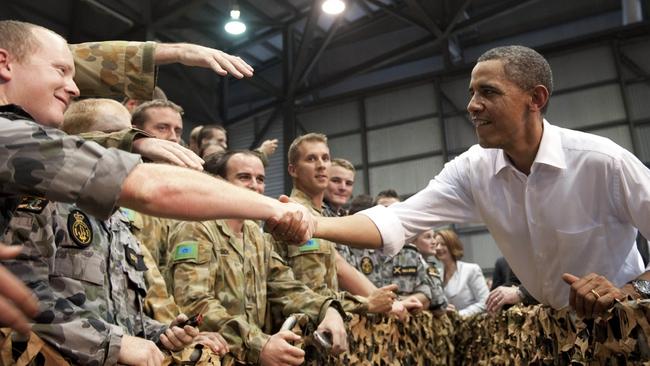 Former US President Barack Obama greeting Australian troops at RAAF Base Darwin in Darwin on November 17, 2011. The TRG had to provide security for the Obama. Picture: TOPSHOTS/AFP PHOTO/Saul Loeb