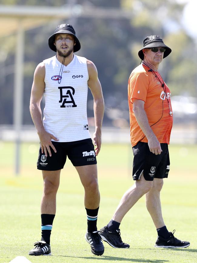 Ken Hinkley walks past Cameron Sutcliffe on the camp. Picture: Sarah Reed