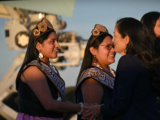 US Interior Secretary Deb Haaland (R) greets members of a Native American community upon arrival at Phoenix Sky Harbor International Airport in Phoenix, Arizona on October 24, 2024. President Biden is expected to issue a formal apology for the federal governmentâs Native American boarding schools during a visit to Arizona on October 25, 2024. Bidenâs message would be the first public apology from a sitting US president in response to a federal policy that wreaked havoc on tribal communities. (Photo by ANDREW CABALLERO-REYNOLDS / AFP)