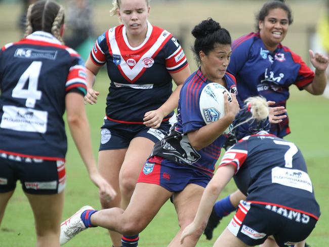 Collies captain Pandora Visesio takes on the Camden defenders.