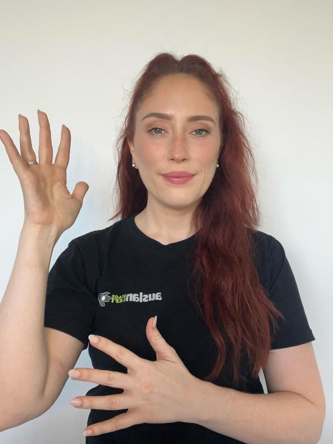 She is pictured making the sign for Auslan. Picture: Supplied