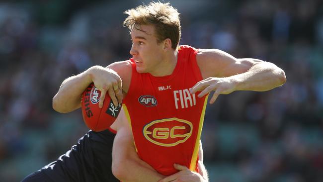 Tom Lynch stands strong in the Tom McDonald tackle. Picture: Michael Klein