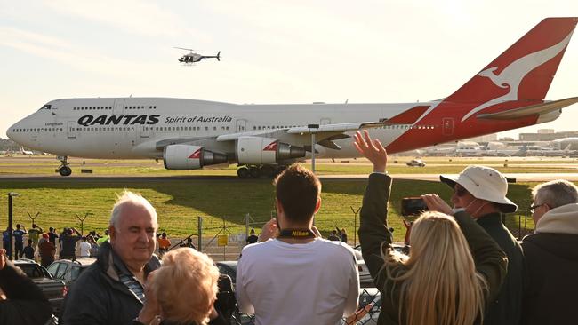 People watch as the last Qantas Boeing 747 airliner prepares to take off from Sydney airport. Peter Parks/AFP