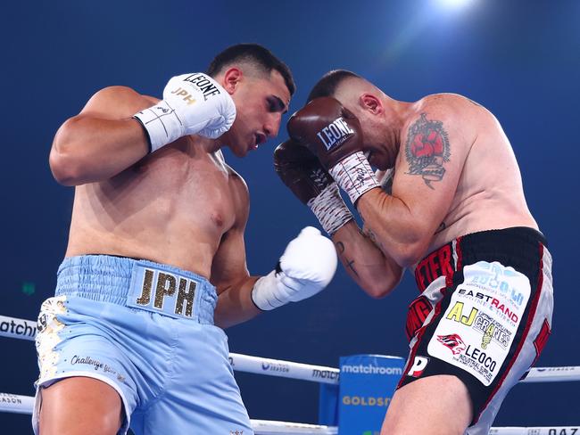 GOLD COAST, AUSTRALIA - JANUARY 08: Justis Huni punches Shaun Potgieter during the IBF Pan-Pacific, WBO Global heavyweight title at the Gold Coast Convention Centre on January 08, 2025 in Gold Coast, Australia. (Photo by Chris Hyde/Getty Images)