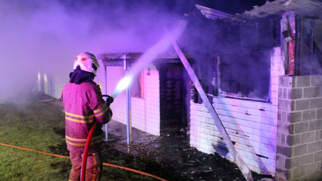 Firefighters at the scene of the New Norfolk blaze, which police believe may have been deliberately lit. Picture: Damian Bester/New Norfolk News