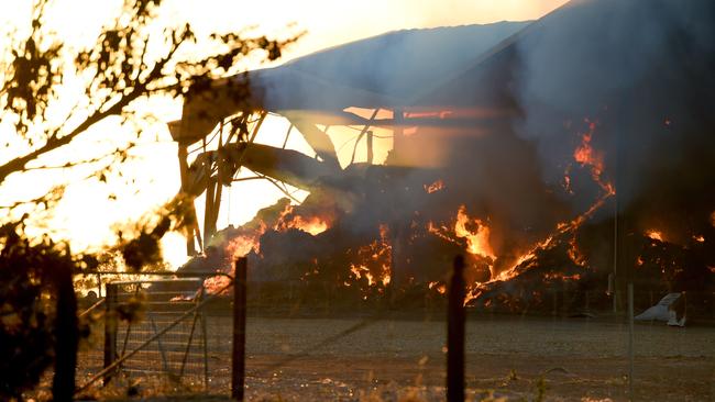 A hay shed burns near Hamley Bridge, during the Pinery bushfire in 2015. Picture: Naomi Jellicoe