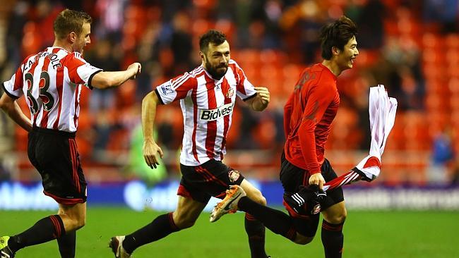 Ki Sung-Yong revels after his extra-time heroics. 