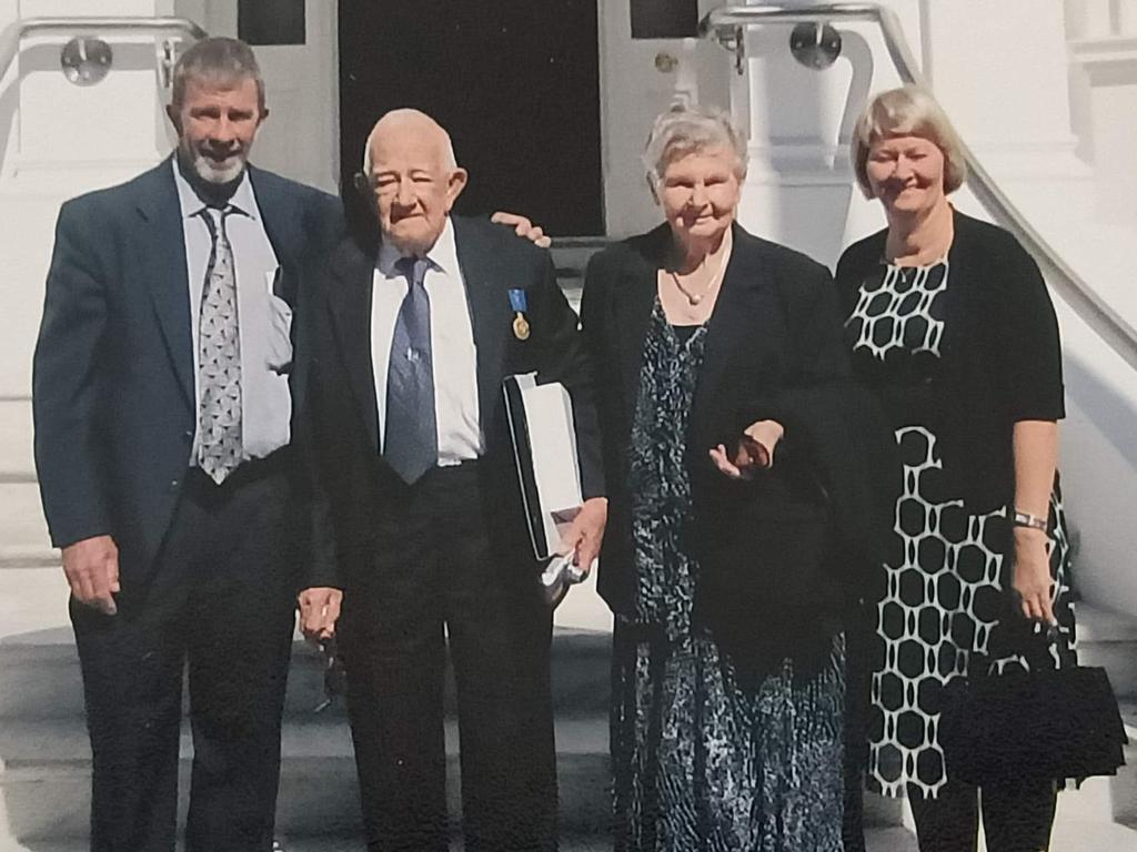 Col Hamilton with wife Ruth and children David and Diane when he received his Medal of the Order of Australia.