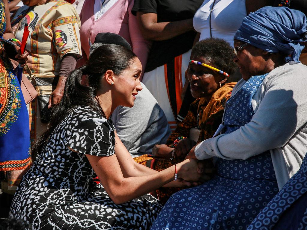 Meghan couldn’t help but beam as she spoke to the locals. Picture: Betram Malgas/AFP