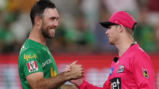 Glenn Maxwell of the Stars (left) shakes hands with Steve Smith of the Strikers during the Big Bash League (BBL) cricket match between the Melbourne Stars and the Sydney Sixers at the MCG in Melbourne, Friday, January 31, 2020. (AAP Image/Michael Dodge) NO ARCHIVING, EDITORIAL USE ONLY, IMAGES TO BE USED FOR NEWS REPORTING PURPOSES ONLY, NO COMMERCIAL USE WHATSOEVER, NO USE IN BOOKS WITHOUT PRIOR WRITTEN CONSENT FROM AAP