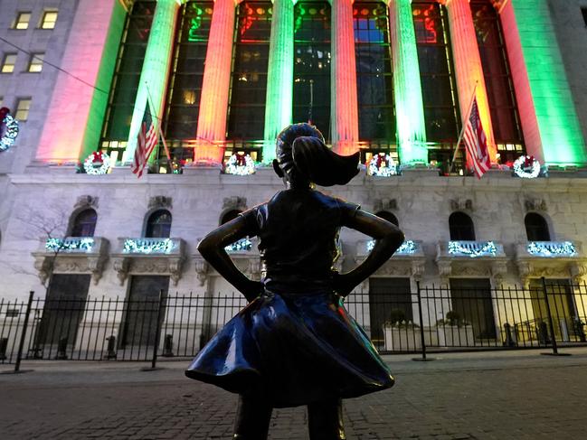 The Fearless Girl, a bronze sculpture by Kristen Visbal,  stands across from the New York Stock Exchange in the Financial District ofÂ New York on December 30, 2022. - Wall Street stocks marked a gloomy end to 2022, slumping to close lower in their worst annual showing in years. Surging inflation and steep interest rate hikes to cool demand have battered markets and investor sentiment this year, on top of global shocks like Russia's invasion of Ukraine. (Photo by TIMOTHY A. CLARY / AFP)