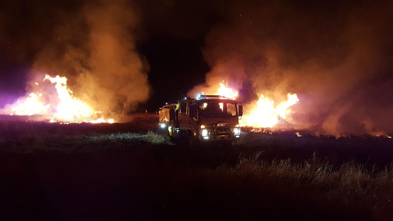 Volunteer firefighters from Nikenbah as well as other Rural Fire Service crews after battling a blaze in Kilkivan on Tuesday night/Wednesay morning.