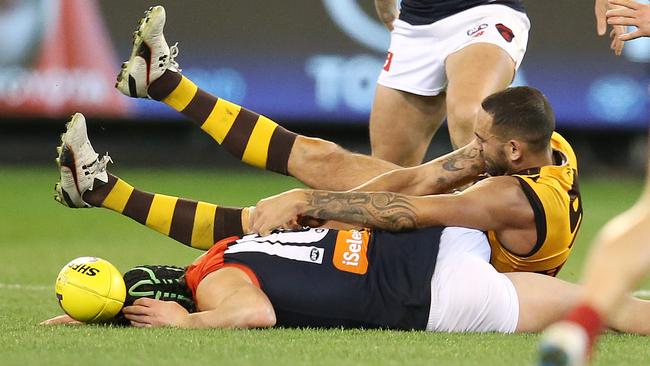 Melbourne's Angus Brayshaw collides with Hawthorn's Shaun Burgoyne. Pic: Michael Klein
