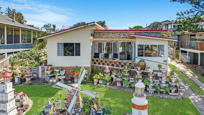 WINDMILL HOUSE: Generations of people of stopped to admire this house at 58 Shelley Beach Rd, Ballina which was decorated by former owner Peter Gutter with quirky tiled and decorated objects.