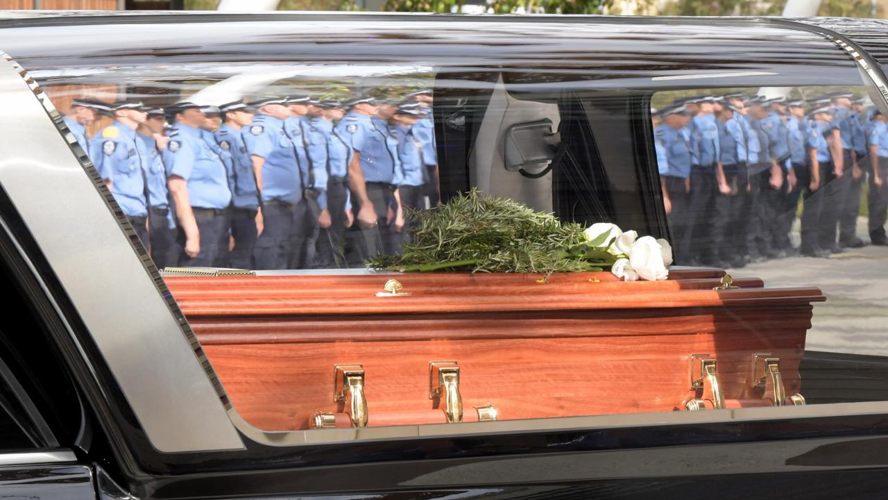 The coffin of Constable Woods leaving the service in an honour guard. Picture: NCA NewsWire / Sharon Smith