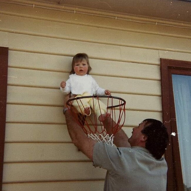 From womb straight to hoop – the story of a basketball prodigy begins. Michelle with dad. Picture: SUPPLIED