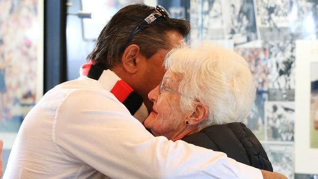 Nicky Winmar hugs a fan and reflects on the life and career of his former captain. Picture: Mark Stewart