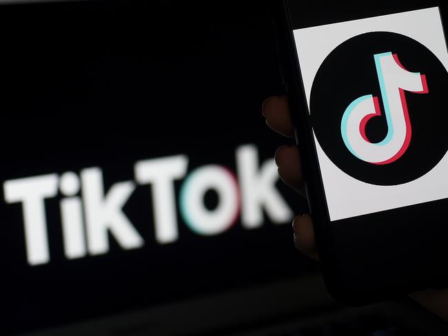 (FILES) In this photo illustration, the social media application logo, TikTok is displayed on the screen of an iPhone on April 13, 2020, in Arlington, Virginia (Photo by Olivier DOULIERY / AFP)