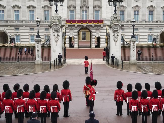 Coldstream Guards stand to attention in front of Buckingham Palace. Picture: Getty Images