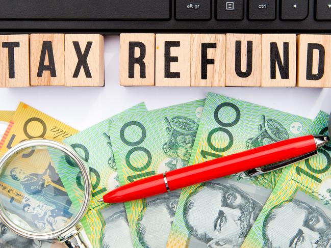 Tax Refund - Australia - wooden letters with keyboard, money and calculator, generic