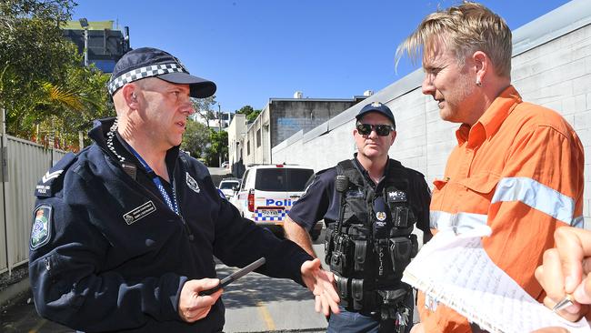 Ben Pennings getting told to move on by the police during an Adani protest last year. Picture: AAP image, John Gass