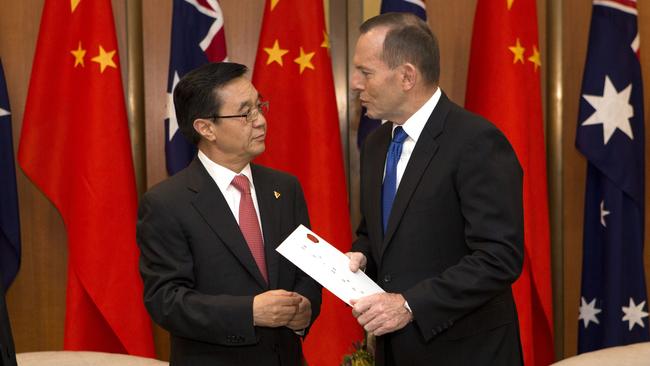 Prime Minister Tony Abbott shakes on the China Australia Free Trade Agreement with China’s Minister of Commerce Gao Hucheng.