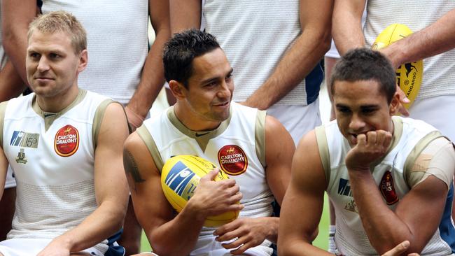 Andrew McLeod between Kane Cornes and Peter Burgoyne suited up for the AFL Dream Team that took on Victoria at the MCG in 2008.