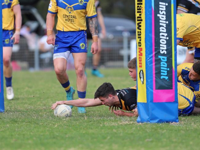 Jets winger Beau Luland reaches out to score. Picture: Steve Montgomery/Ourfootyteam