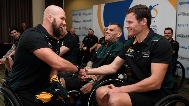 Australian wheelchair rugby team captain Ryley Batt (left) presenting Andrew Edmondson with a Steelers jersey in 2018.