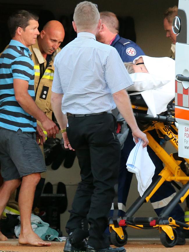 Paramedics treat Ms Jay after she was stabbed. Picture: Nathan Edwards