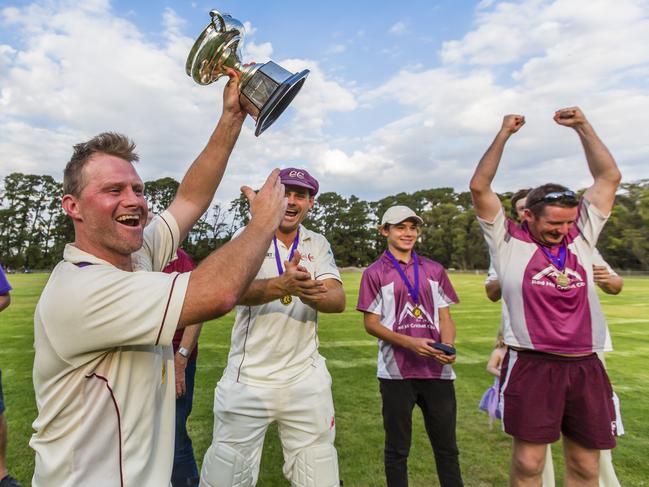 Red Hill cricket captain-coach Simon Dart lifts the 2016-17 premiership cup. Picture: Valeriu Campan