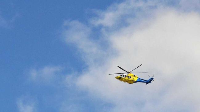 The RACQ LifeFlight helicopter leaves Kingaroy Hospital following a crash on the D'Aguliar Hwy. Picture: Will Hunter