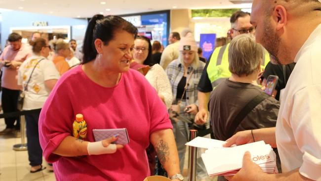 Helen Johnson receives her Coles gift voucher from Adrian Porletti at Northgate on December 2 2024. Picture: Elise Kaine