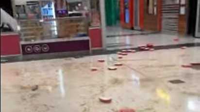 Shots from the video footage Jacinta Corbett took on her phone after vandals targeted Stockland's Donut King on Thursday night.