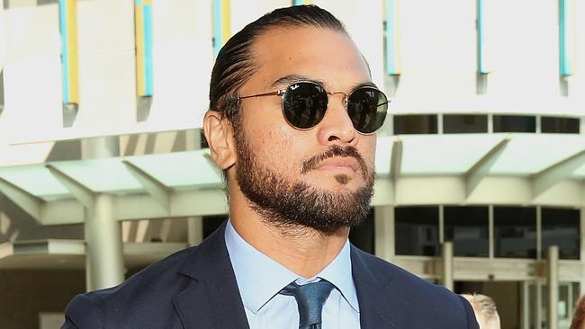 Rugby union player Karmichael Hunt leaves the Magistrates Court in Brisbane on Monday, February 19, 2018. Mr Hunt has had a drugs charge dropped due to a lack of evidence but has been fined $600.  (AAP Image/Jono Searle) NO ARCHIVING