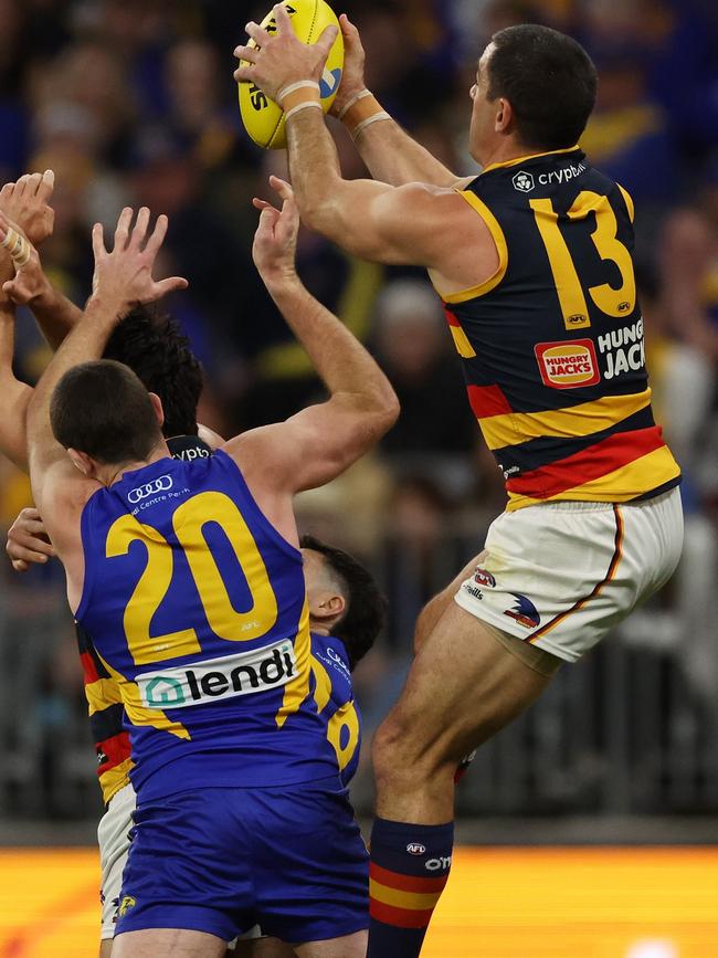 Adelaide’s Taylor Walker leaps high over West Coast’s Jeremy McGovern to haul in a screamer at Optus Stadium in Round 24. Picture: Will Russell/AFL Photos via Getty Images.