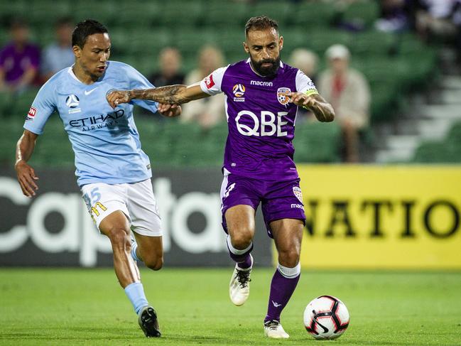 Kearyn Baccus for Melbourne City and Diego Castro of the Perth Glory during the Round 7 A-League match between Perth Glory and Melbourne City at NIB Stadium in Perth, Saturday, December 8, 2018. (AAP Image/Tony McDonough) NO ARCHIVING, EDITORIAL USE ONLY