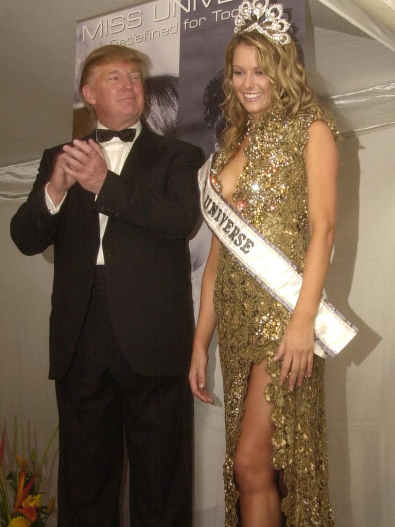 Donald Trump and Miss Universe winner Jennifer Hawkins of Australia, right, pose during a news conference at the convention center in Quito, Ecuador in 2004. Picture: Supplied