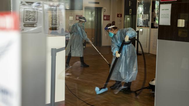Cleaners disinfect the Holiday Inn hotel.