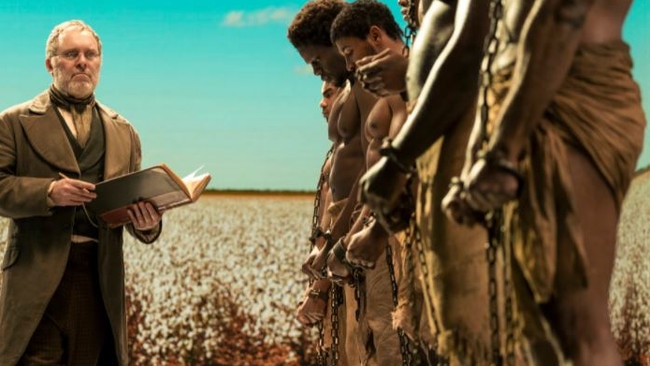 The special features actors playing NFL prospects who morph into slaves at an auction. Picture: Netflix