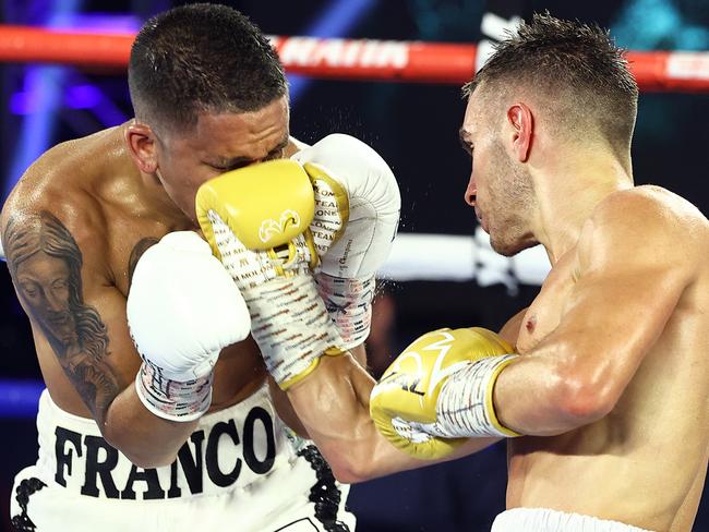 Andrew Moloney punches Joshua Franco during their WBA Super-Flyweight World Title fight at the MGM Grand.